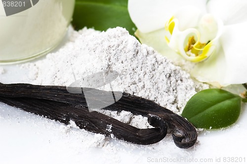 Image of vanilla beans with aromatic sugar, milk and flower 