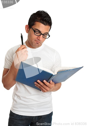 Image of Man reading book and thinking