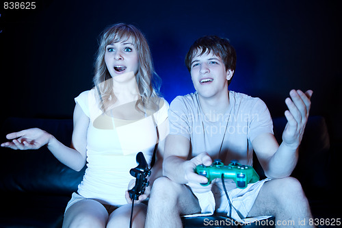 Image of Couple playing video games