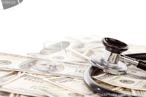 Image of Stethoscope Laying on Stacks of Money