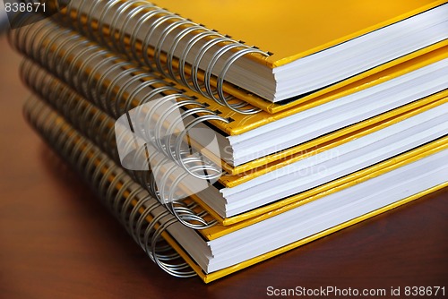 Image of Yellow notebooks stack