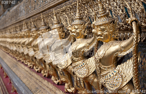 Image of Golden figures warrior in royal palace