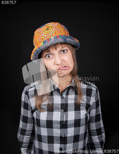 Image of Young beautiful girl makes faces