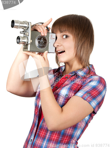 Image of Girl in plaid shirt with movie camera
