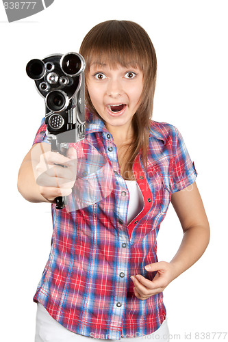 Image of Girl in plaid shirt with movie camera