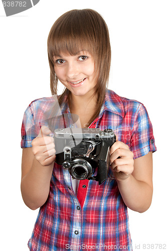 Image of Beautiful young girl with old analog photo by camera