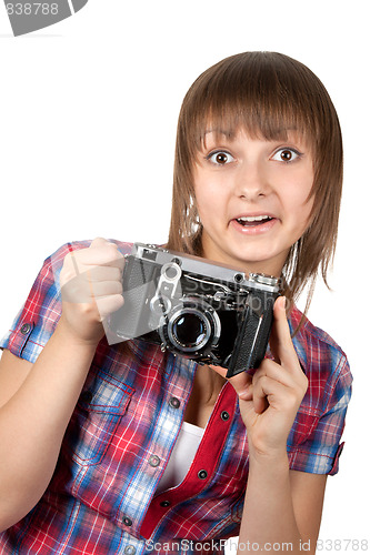 Image of Young girl with old analog photo by camera