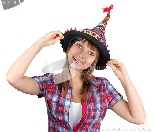 Image of Young beautiful girl in colour hat