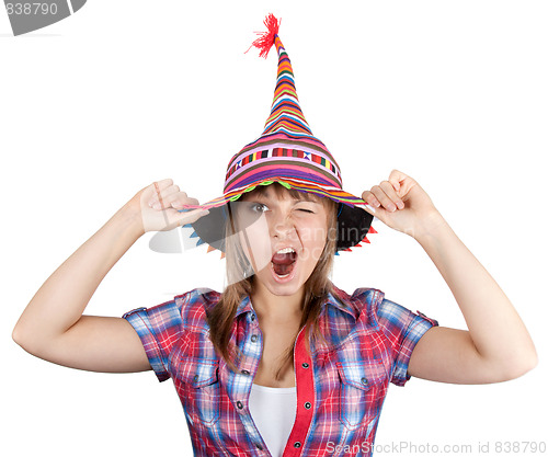 Image of Young beautiful girl in colour hat