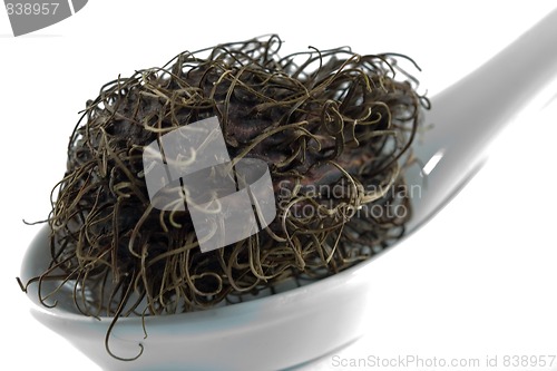 Image of rambutan on a white spoon made of china