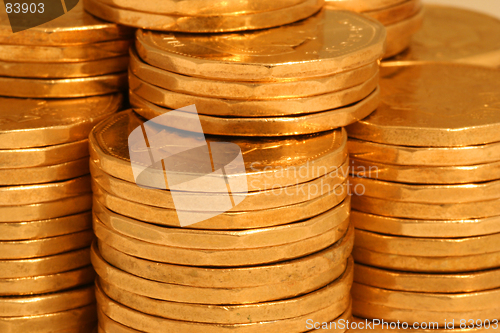 Image of golden coins from side