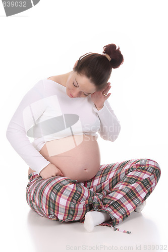 Image of pregnant woman listening
