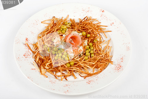 Image of Russian salad with salmon fish closeup