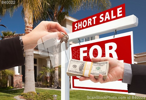 Image of Handing Over Cash For House Keys and Short Sale Sign