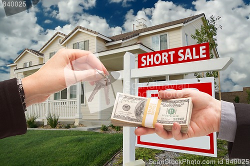 Image of Handing Over Cash For House Keys and Short Sale Sign