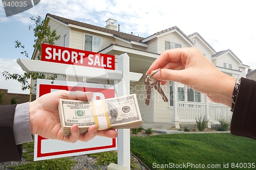 Image of Handing Over Cash For House Keys and Short Sale Sign