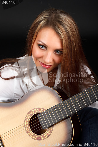 Image of Woman with guitar.