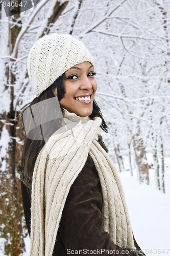 Image of Happy woman outside in winter