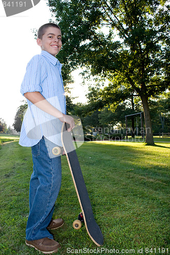 Image of Boy with Skateboard