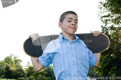 Image of Teen with His Skateboard