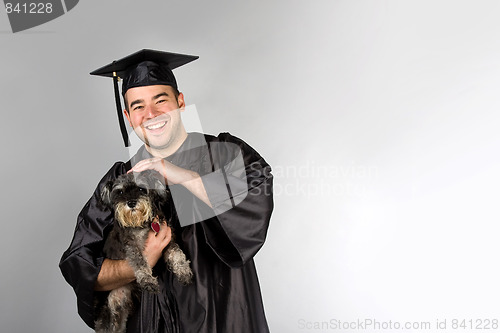 Image of Graduate Holding Dog