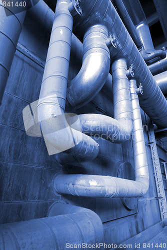 Image of different size and shaped pipes at a power plant