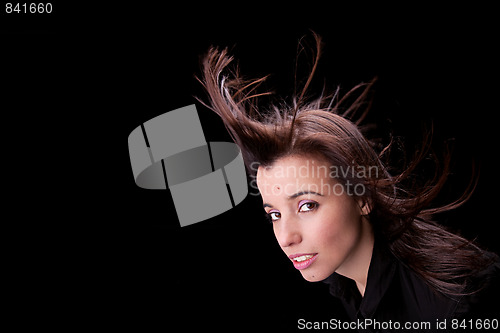 Image of beautiful woman with hair in the wind