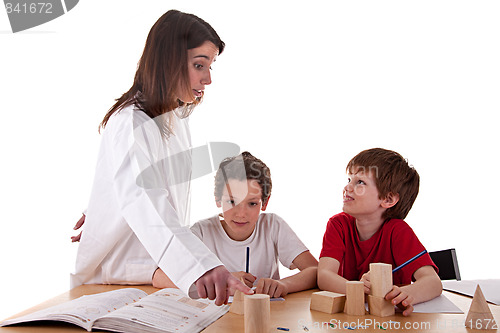 Image of Two students with the teacher