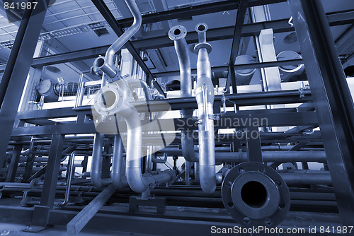 Image of different size and shaped pipes at a power plant