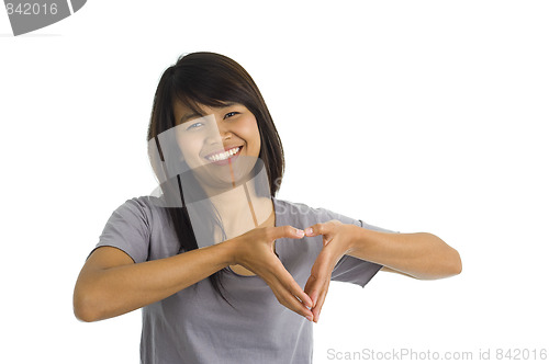 Image of asian beauty shaping a heart