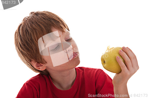 Image of boy eating a green apple