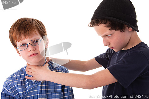 Image of a teen beating a child