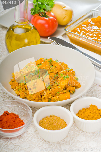 Image of curry beef rice and potatoes