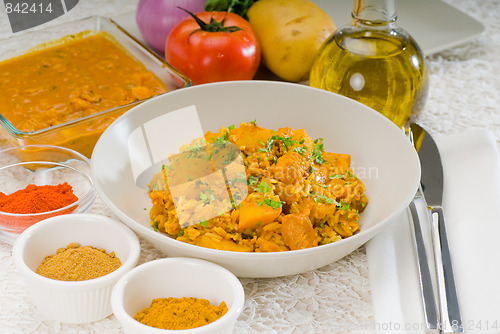 Image of curry beef rice and potatoes