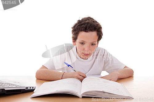 Image of cute boy on the desk studying