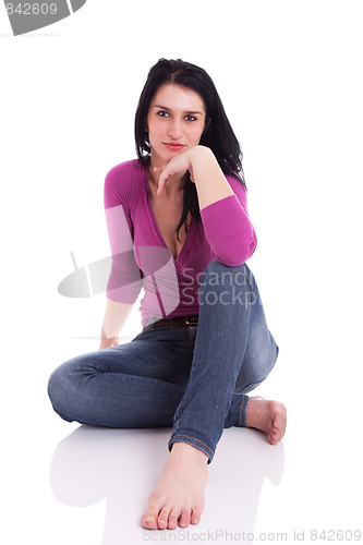 Image of beautiful woman, sitting on the floor