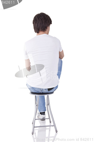 Image of man sitting on a bench in back