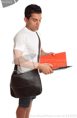 Image of Student with brown bag and books