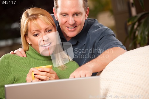 Image of Handsome Couple Using Laptop