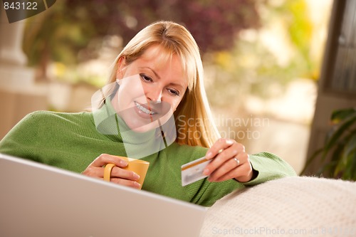 Image of Beautiful Woman with Credit Card Using Laptop