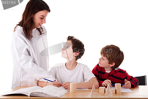 Image of Two students with the teacher