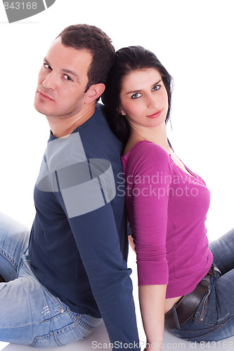 Image of couple sitting  back to back