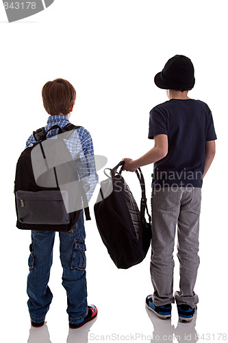 Image of Back of schoolboy holding backpack