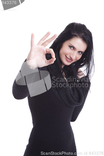 Image of Young pretty women with thumb ok