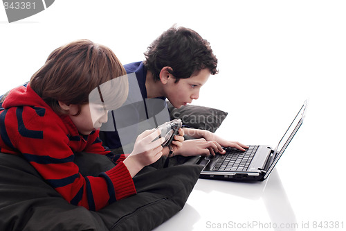 Image of children playing computer and video games