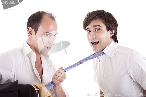 Image of two young businessmen grasping his tie