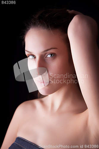 Image of beautiful woman, holding her hair with his hand