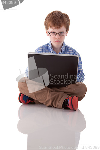 Image of cute boy playing computer