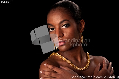 Image of African woman face with gold jewels