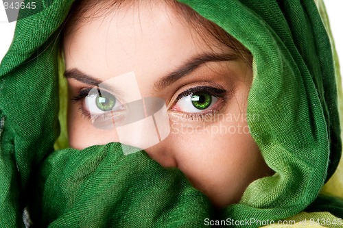 Image of Face with green eyes and scarf